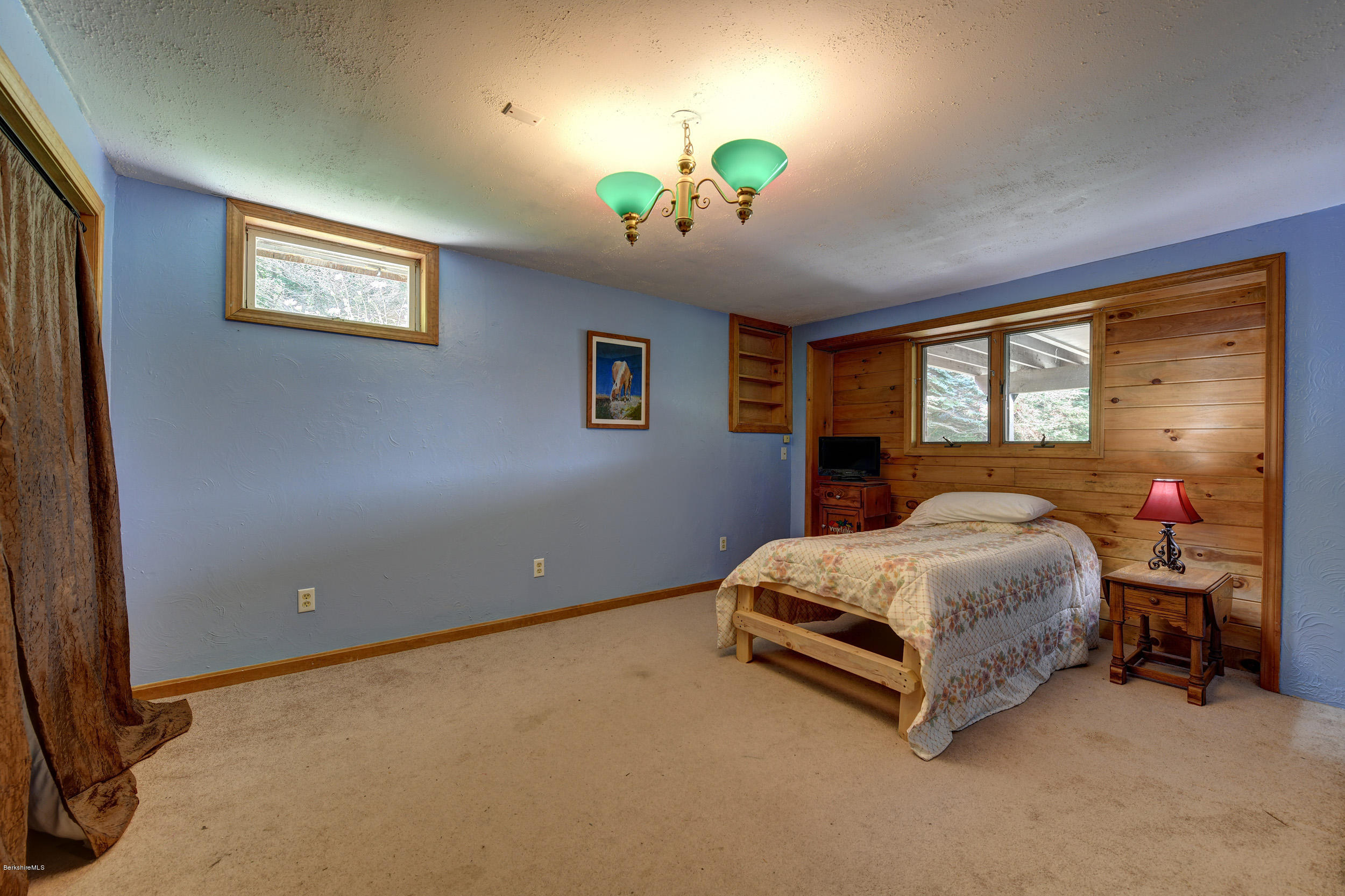 26 Andes Road Peru, MA 01235 - Photo 26 of 52 a bed room with a bed and a chandelier