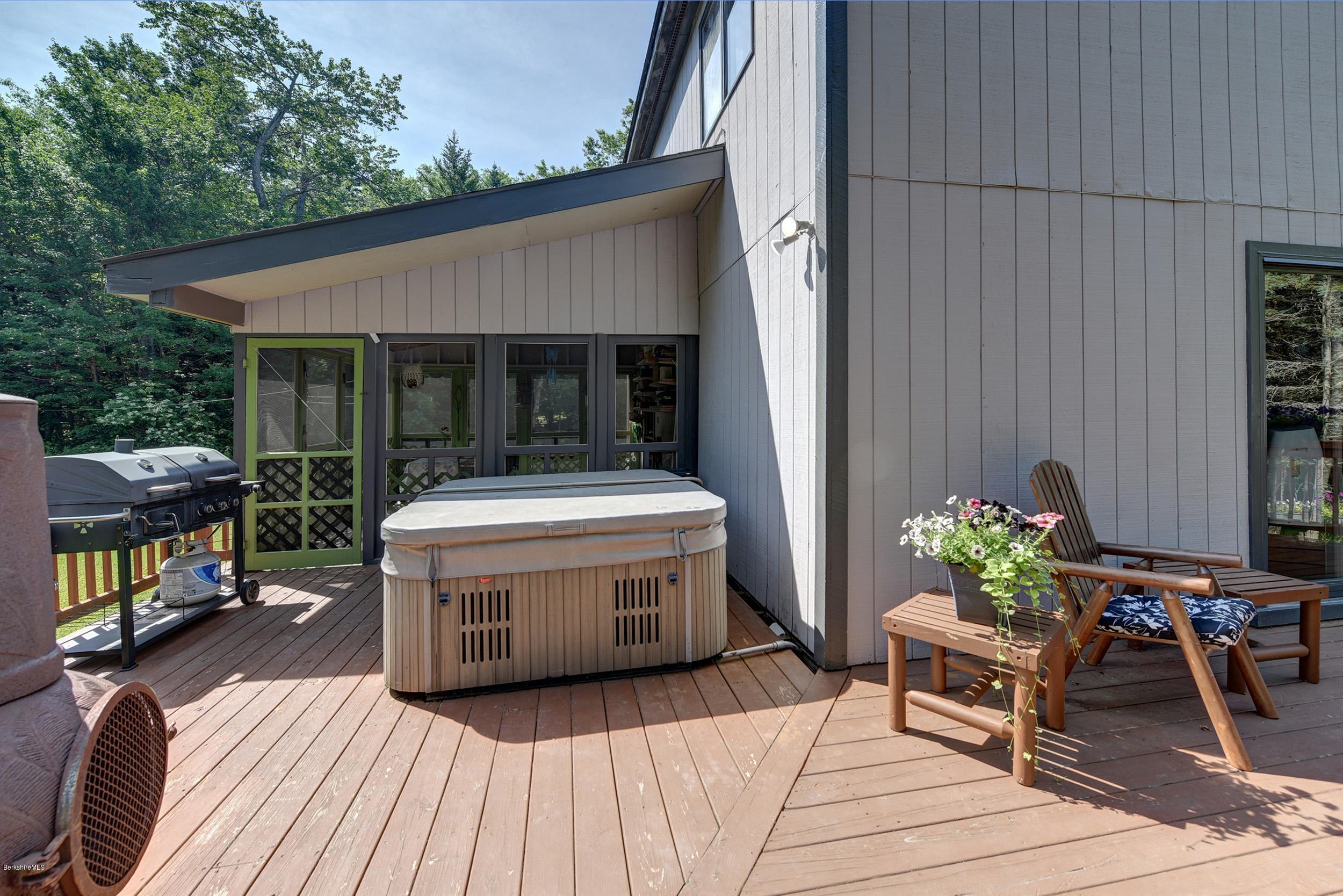 26 Andes Road Peru, MA 01235 - Photo 33 of 52 a view of a patio with table and chairs potted plants with wooden floor