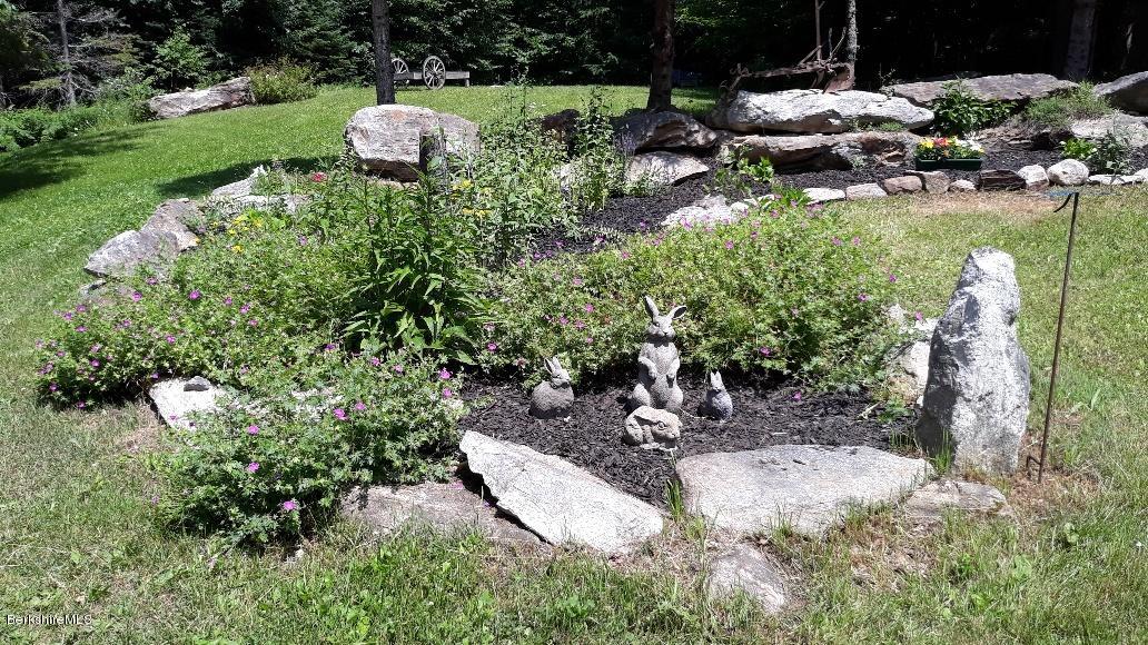 26 Andes Road Peru, MA 01235 - Photo 47 of 52 a backyard of a house with a yard and outdoor seating