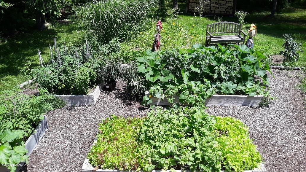 26 Andes Road Peru, MA 01235 - Photo 48 of 52 a view of a garden with a bench