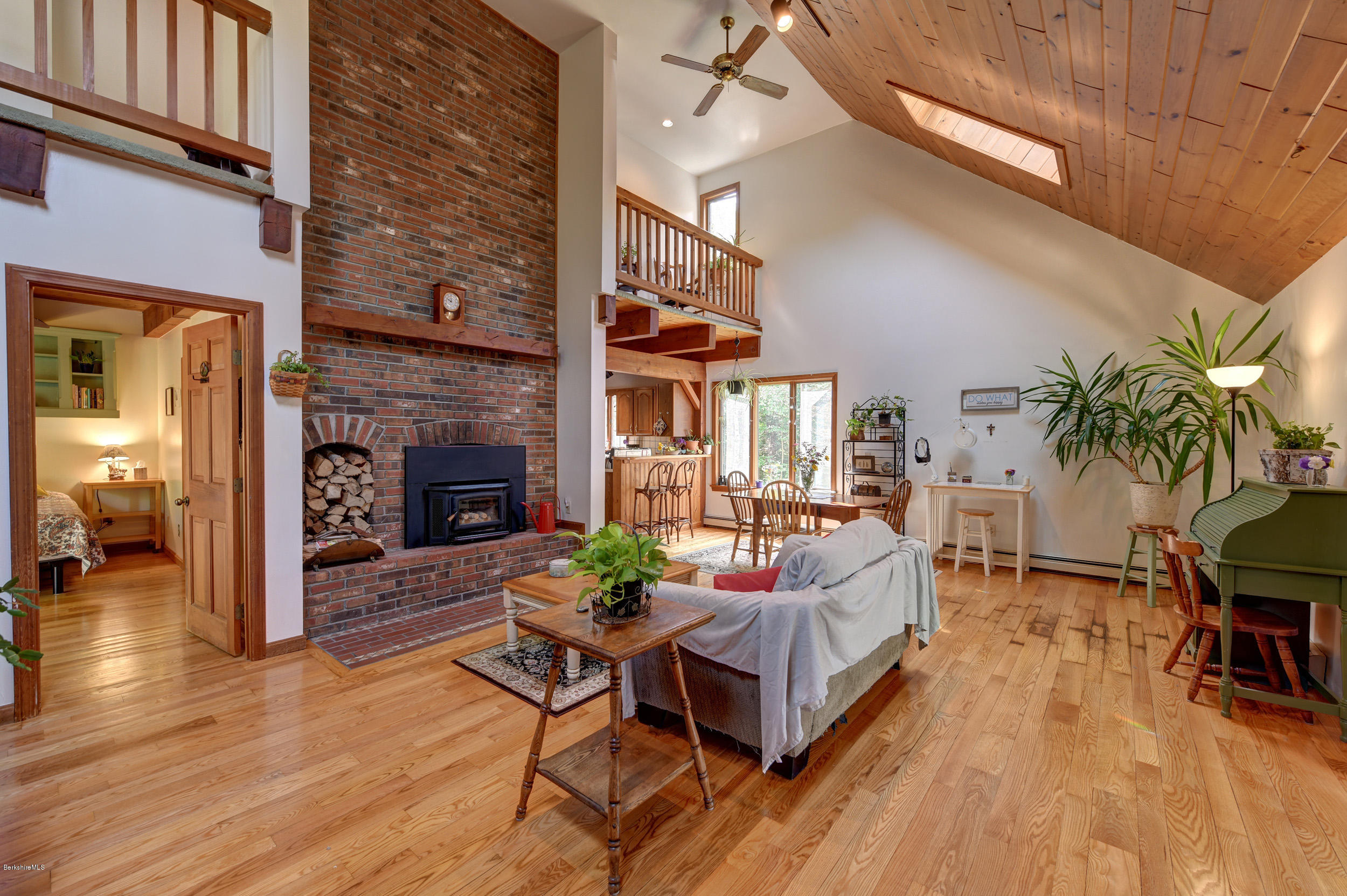 26 Andes Road Peru, MA 01235 - Photo 7 of 52 a living room with furniture wooden floor and a fireplace