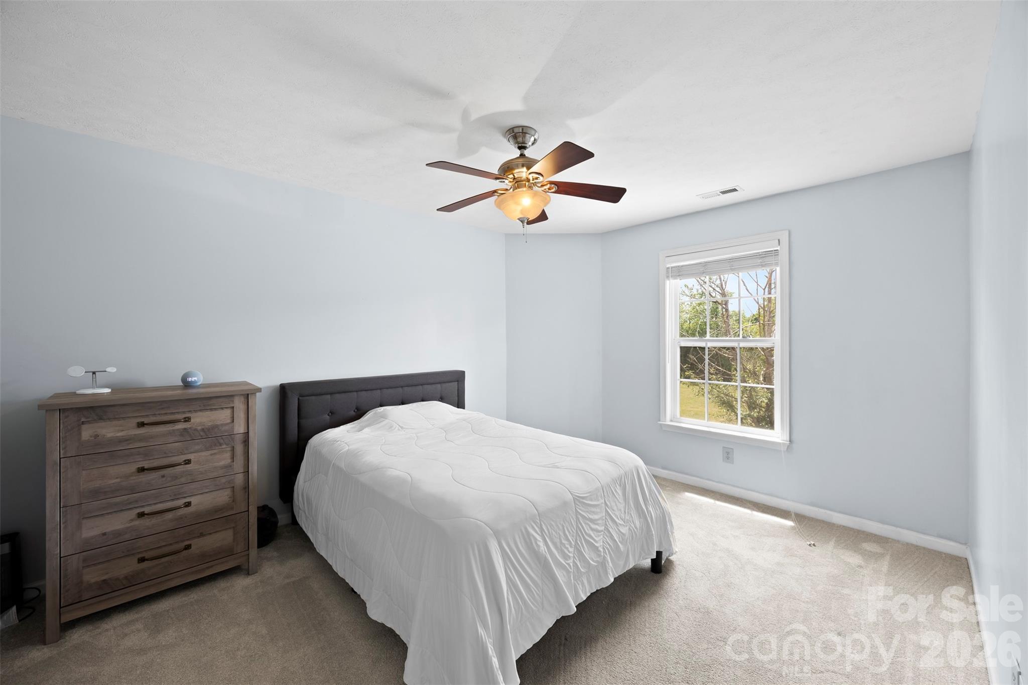 1720 Grove Tree Lane Clover, SC 29710 - Photo 18 of 43 a bedroom with a bed and a chandelier