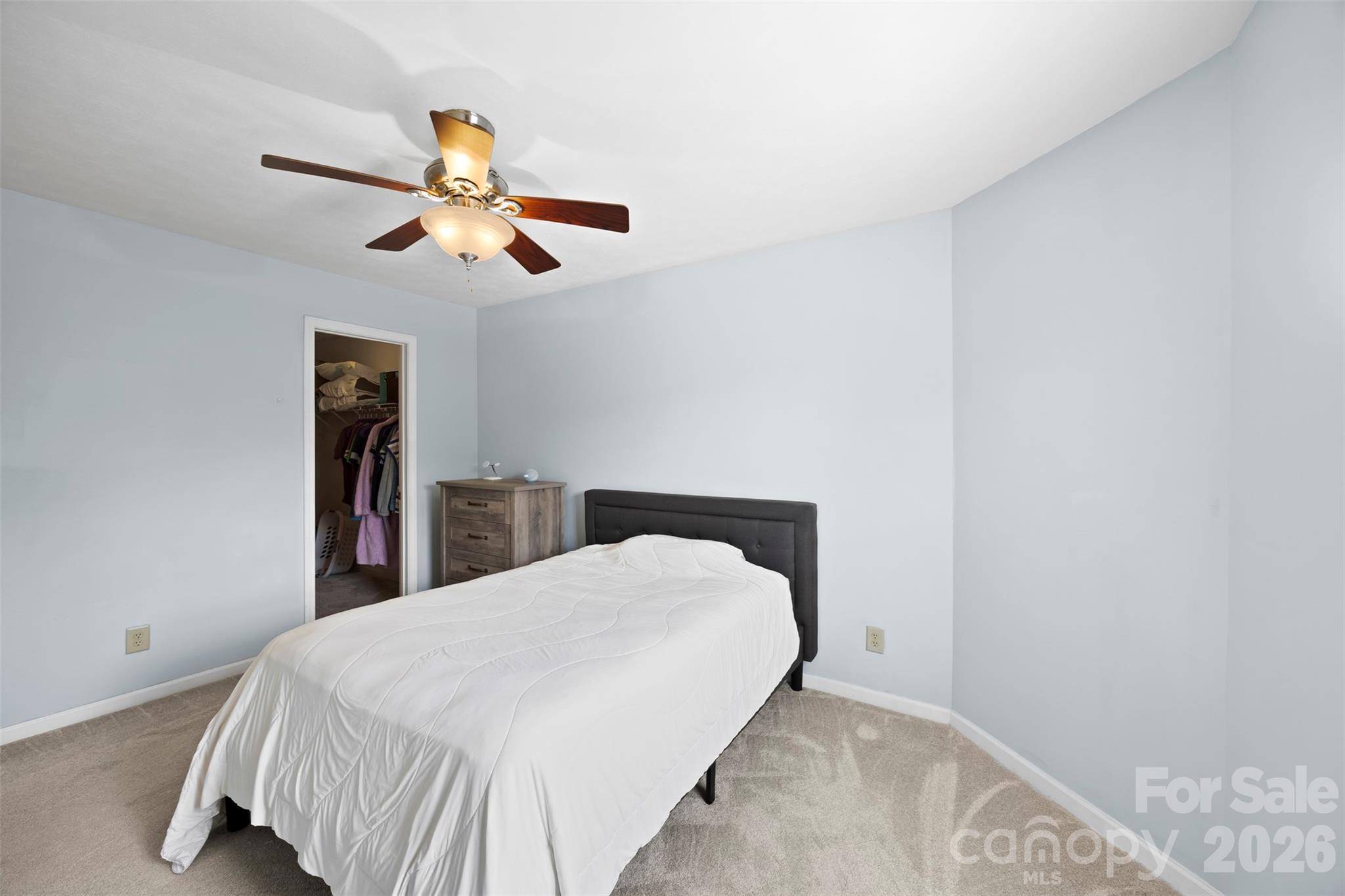 1720 Grove Tree Lane Clover, SC 29710 - Photo 19 of 43 a bedroom with a bed and a chandelier