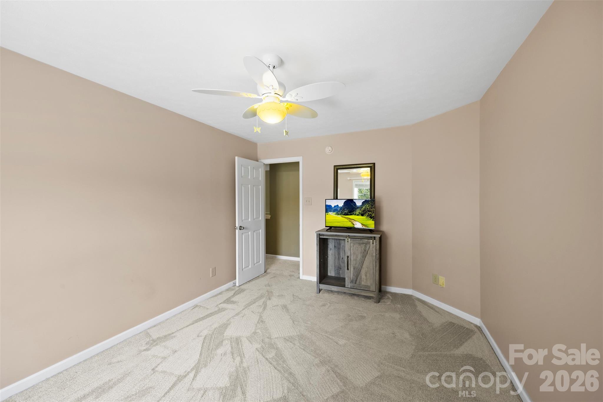 1720 Grove Tree Lane Clover, SC 29710 - Photo 27 of 43 a view of a bedroom with a bed and ceiling fan