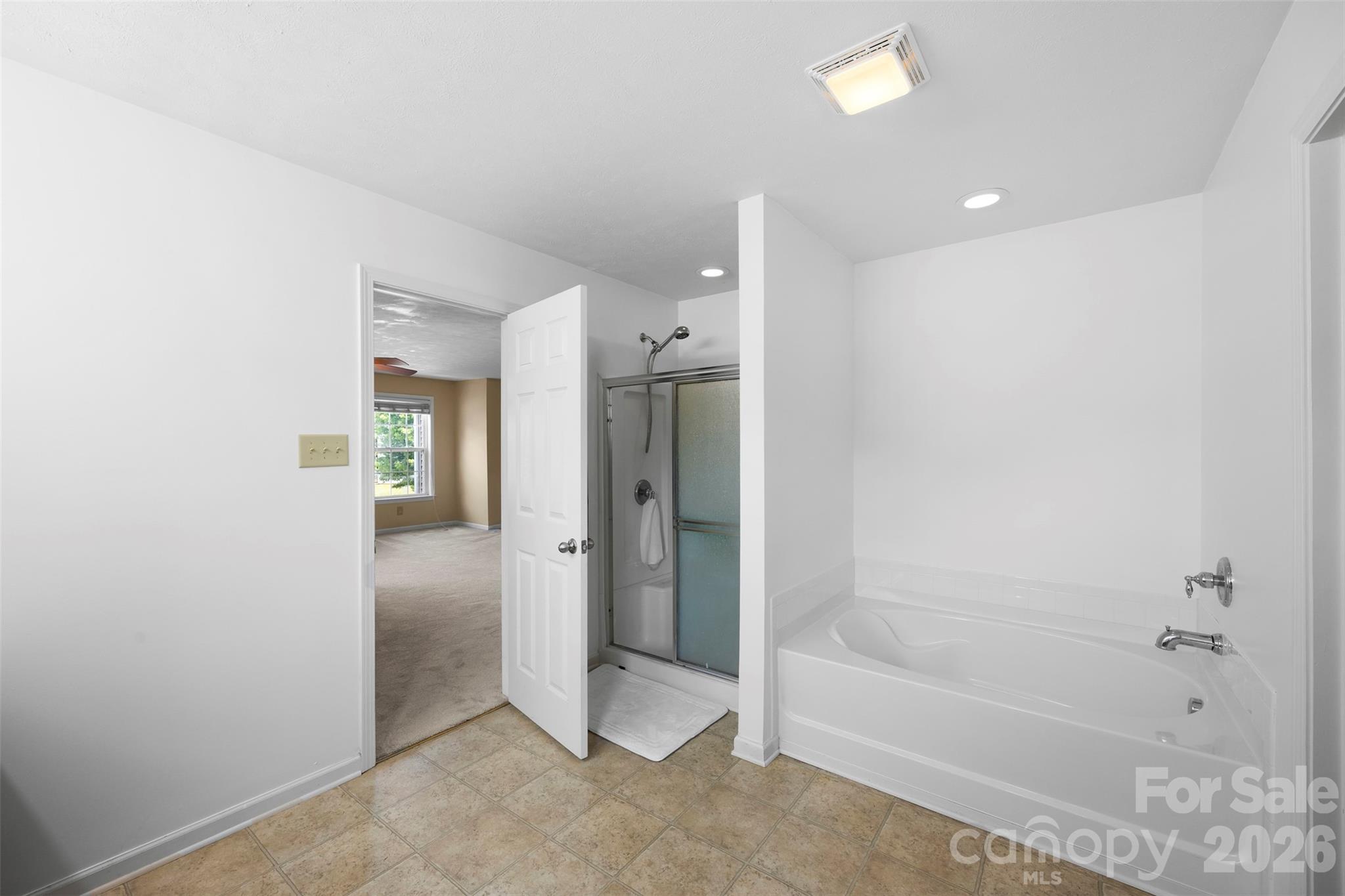 1720 Grove Tree Lane Clover, SC 29710 - Photo 34 of 43 a bathroom with a bathtub and a shower