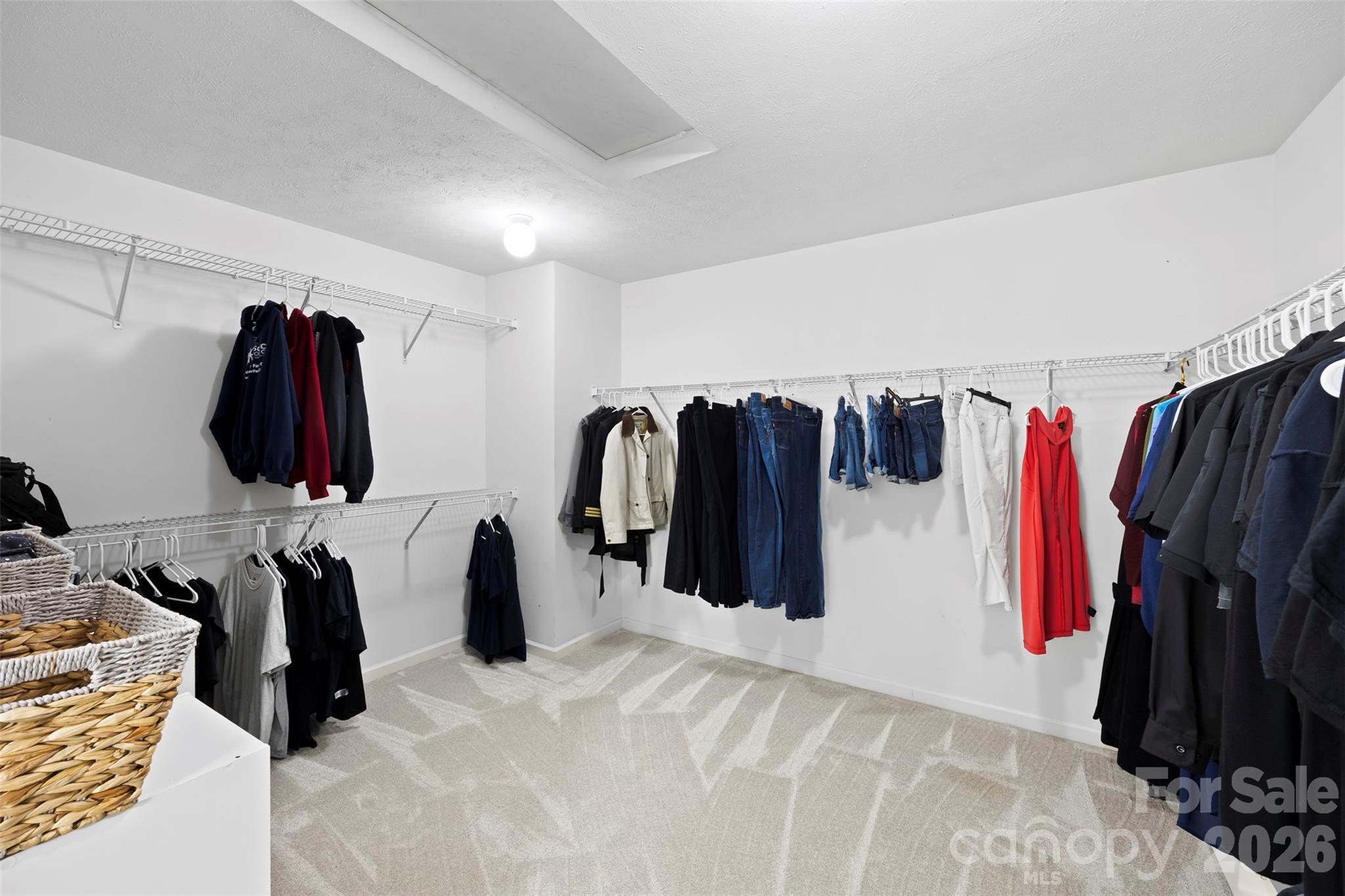 1720 Grove Tree Lane Clover, SC 29710 - Photo 35 of 43 a view of walk in closet with clothes and shoes