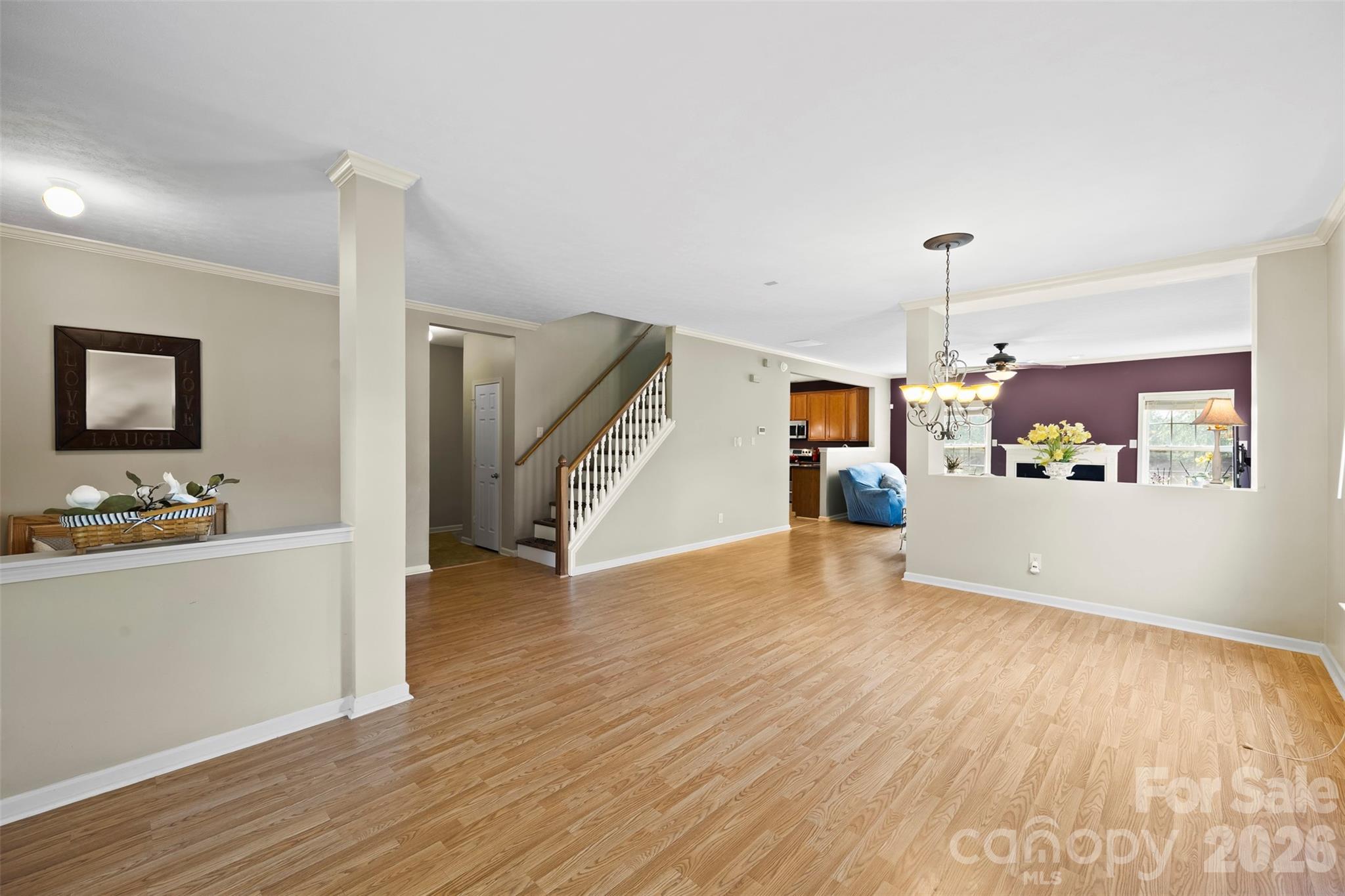 1720 Grove Tree Lane Clover, SC 29710 - Photo 8 of 43 a view of a kitchen with wooden floor and a ceiling fan