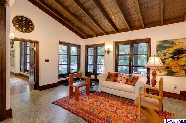 348 Blythe Road La Canada Flintridge, CA 91011 - Photo 11 of 51 a living room with furniture a rug a fireplace and a large window
