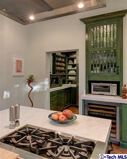348 Blythe Road La Canada Flintridge, CA 91011 - Photo 13 of 51 a table with a stove and a wooden floor