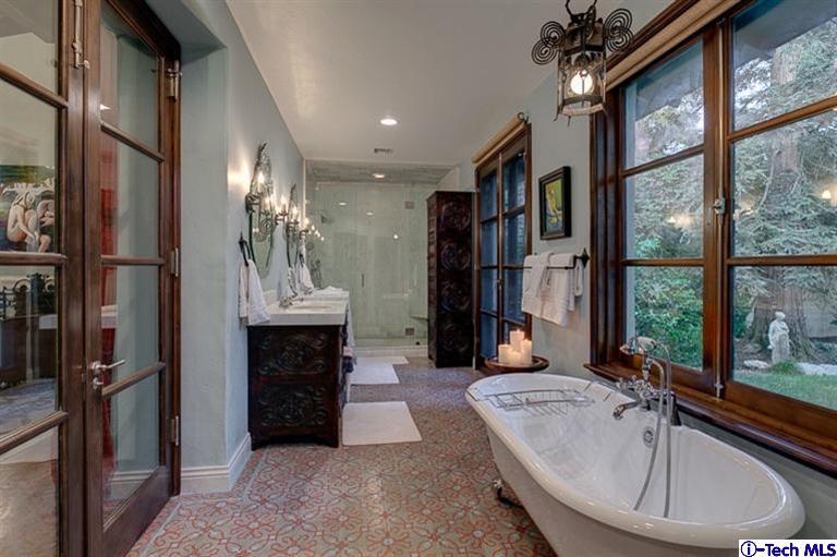 348 Blythe Road La Canada Flintridge, CA 91011 - Photo 22 of 51 a living room with fireplace furniture and a large window