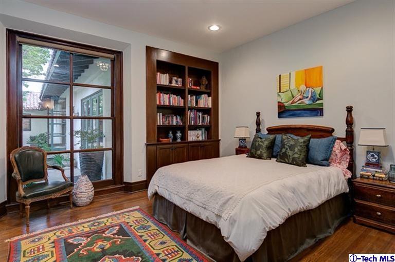 348 Blythe Road La Canada Flintridge, CA 91011 - Photo 28 of 51 a bedroom with a bed a bookshelf and a window