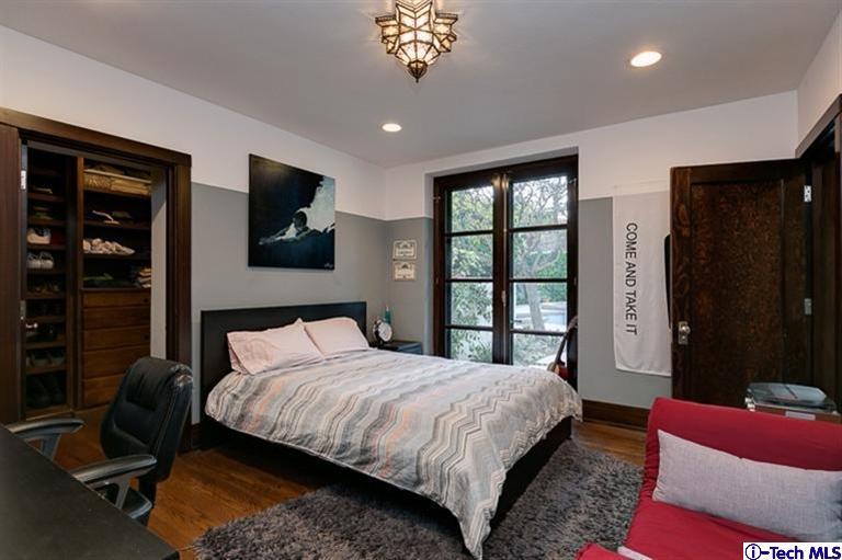 348 Blythe Road La Canada Flintridge, CA 91011 - Photo 30 of 51 a bedroom with a large bed and a flat tv screen