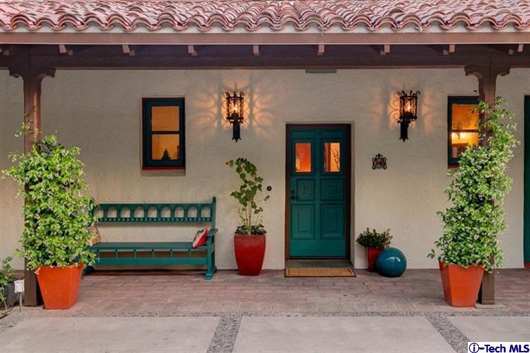 348 Blythe Road La Canada Flintridge, CA 91011 - Photo 4 of 51 a view of a house with a potted plant and a bench