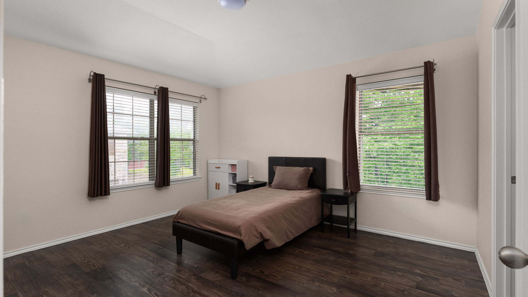 14815 Avery Ranch Boulevard, Unit 1401 Austin, TX 78717 - Photo 14 of 38 Bedroom featuring dark wood-finish flooring and light-toned walls