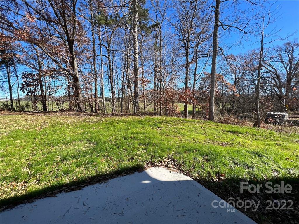 508 Willow Road Salisbury, NC 28147 - Photo 15 of 17 a view of a backyard with large trees