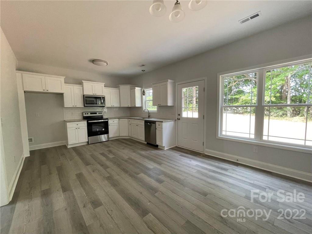 508 Willow Road Salisbury, NC 28147 - Photo 2 of 17 a view of kitchen with wooden floor and electronic appliances