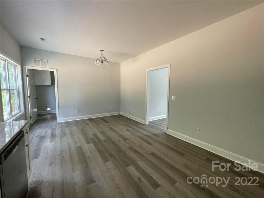 508 Willow Road Salisbury, NC 28147 - Photo 3 of 17 an empty room with wooden floor and windows