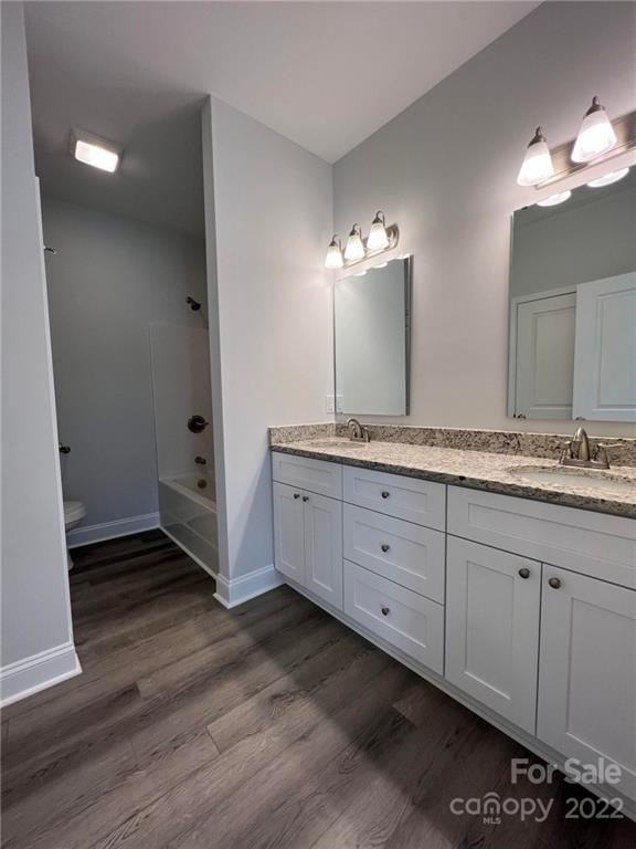 508 Willow Road Salisbury, NC 28147 - Photo 6 of 17 a spacious bathroom with a granite countertop sink a mirror and a vanity