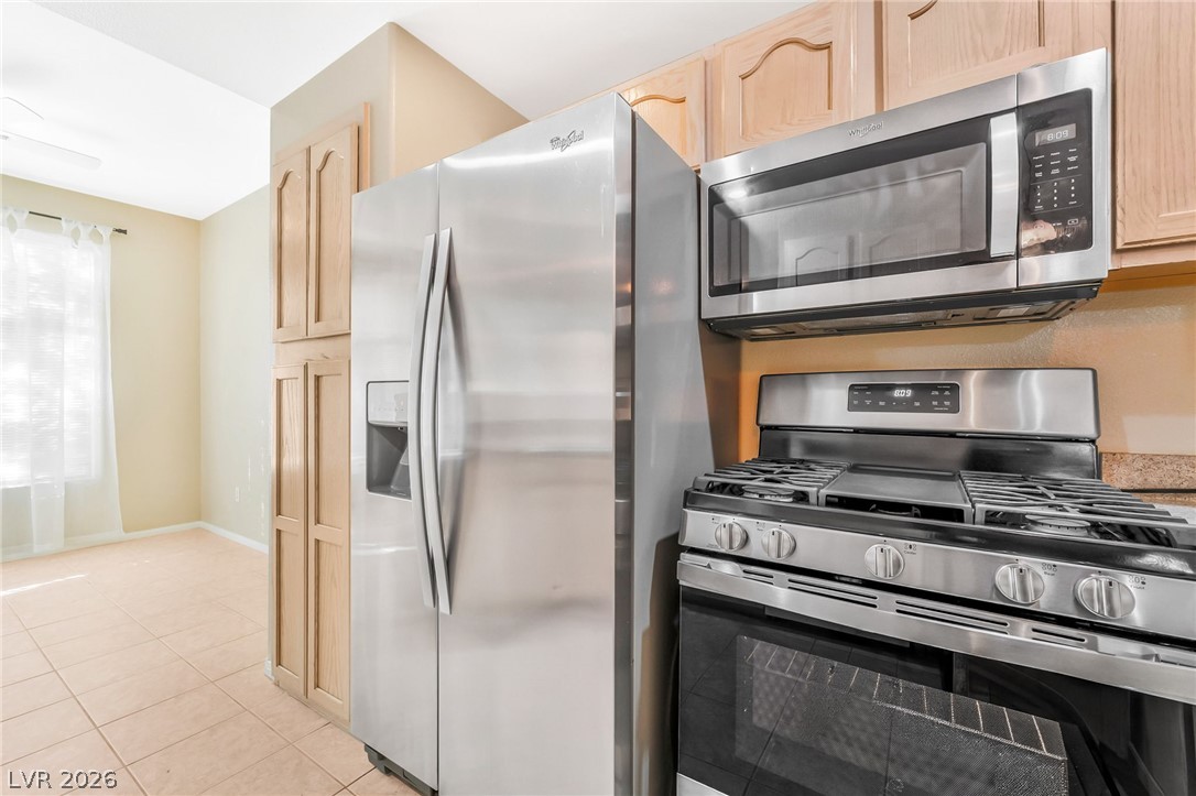2050 West Warm Springs Road, Unit 2411 Henderson, NV 89014 - Photo 14 of 37 Culinary delights await in this well-appointed kitchen, showcasing sleek stainless steel appliances.