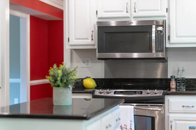 a kitchen with a stove and cabinets