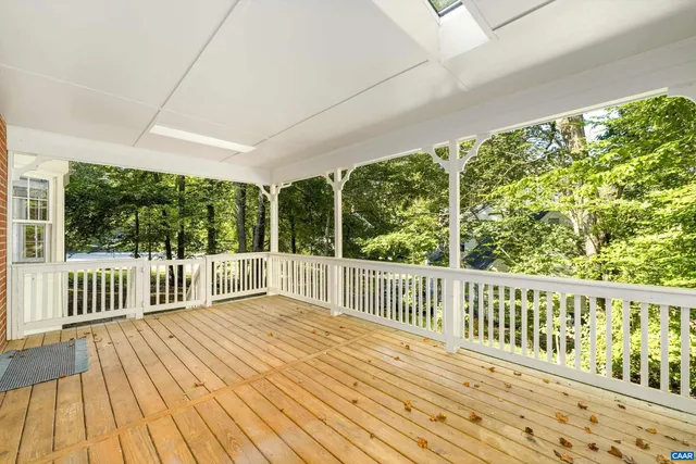 a view of balcony with wooden floor