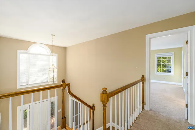 a view of a hallway with windows