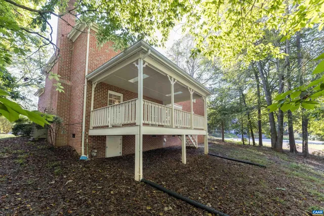 a small house with a tree in the yard