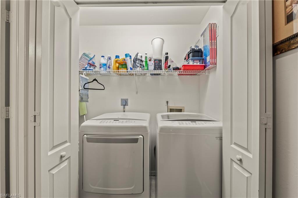 9300 Highland Woods Boulevard, Unit 3307 Bonita Springs, FL 34135 - Photo 12 of 43 a utility room with dryer and washer