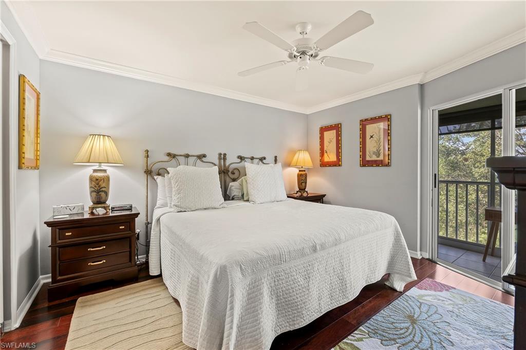 9300 Highland Woods Boulevard, Unit 3307 Bonita Springs, FL 34135 - Photo 13 of 43 a bedroom with a bed a dresser and a window