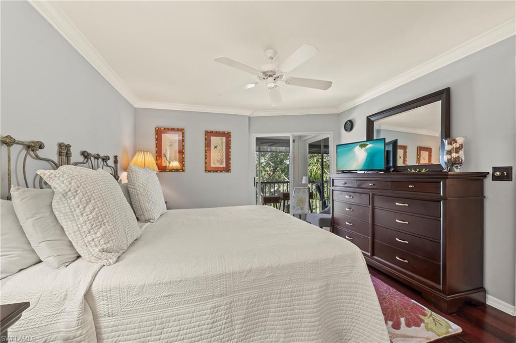 9300 Highland Woods Boulevard, Unit 3307 Bonita Springs, FL 34135 - Photo 14 of 43 a bedroom with a large bed and a dresser