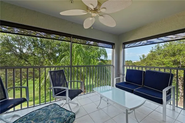 a living room with large windows