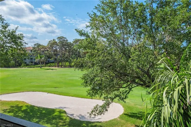 a view of a golf course with a park