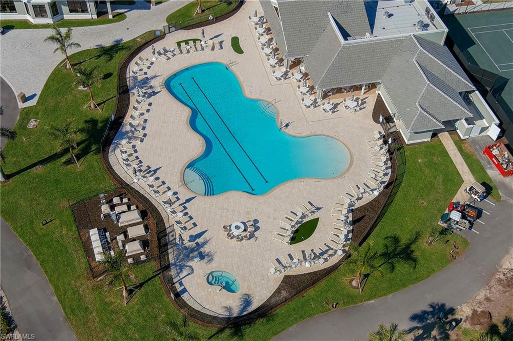 9300 Highland Woods Boulevard, Unit 3307 Bonita Springs, FL 34135 - Photo 24 of 43 an aerial view of a house a table and chairs