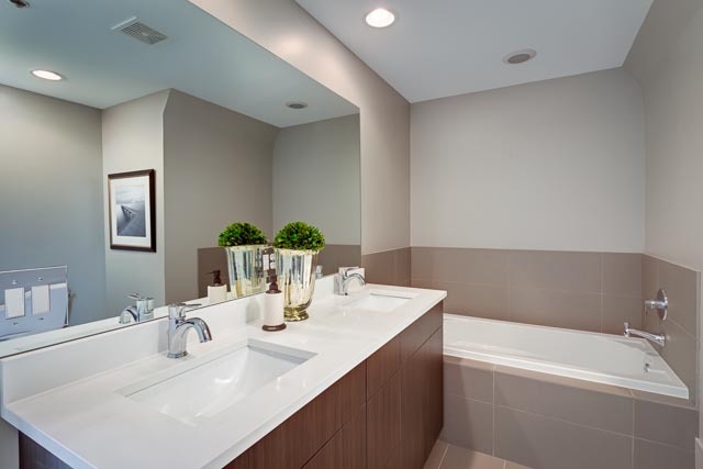 720 West Randolph Street, Unit PH7 Chicago, IL 60661 - Photo 11 of 18 a bathroom with a sink and a bathtub