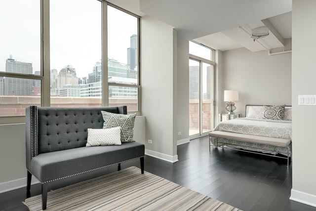 720 West Randolph Street, Unit PH7 Chicago, IL 60661 - Photo 9 of 18 a bedroom with furniture and a window