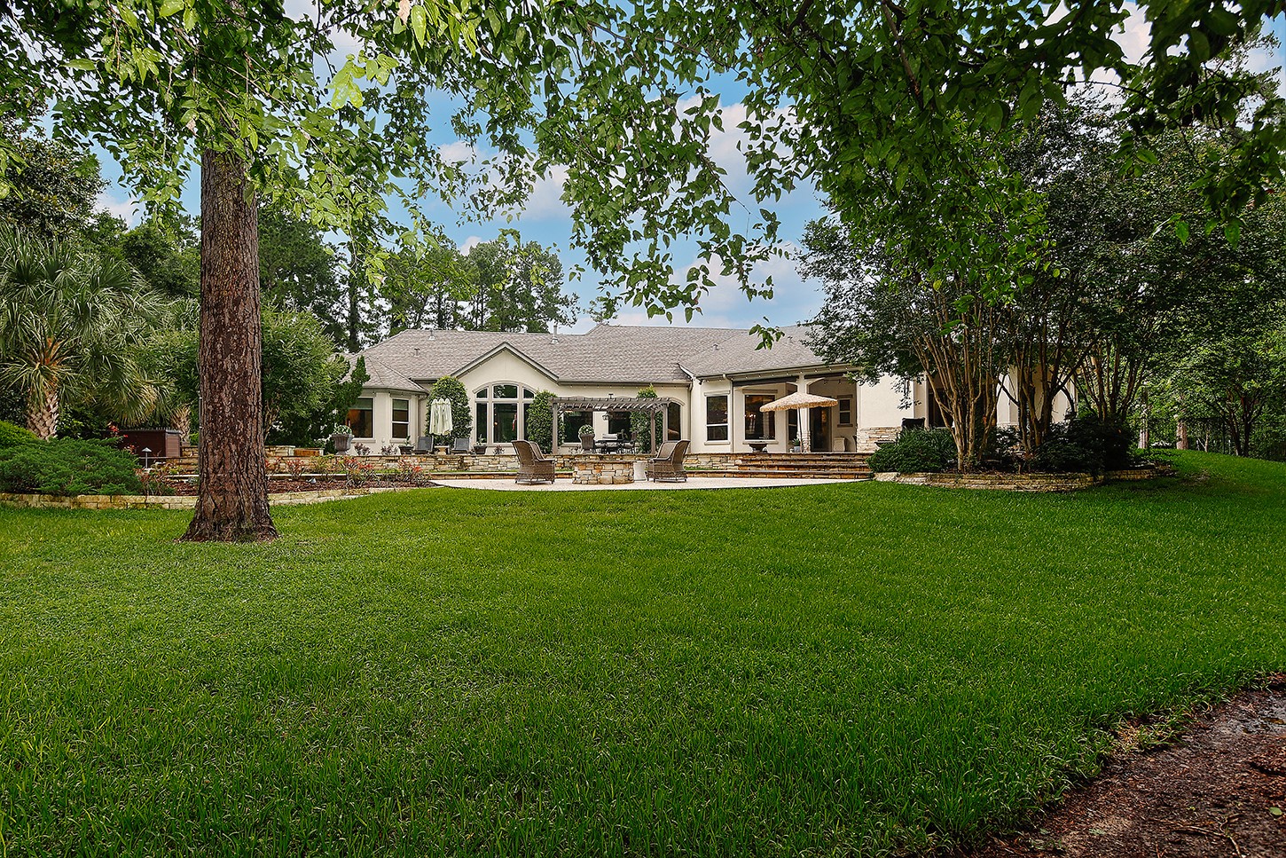 119 Angel Leaf Road The Woodlands, TX 77380 - Photo 47 of 50 a front view of a house with garden