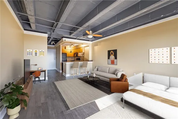 a living room with furniture and a chandelier