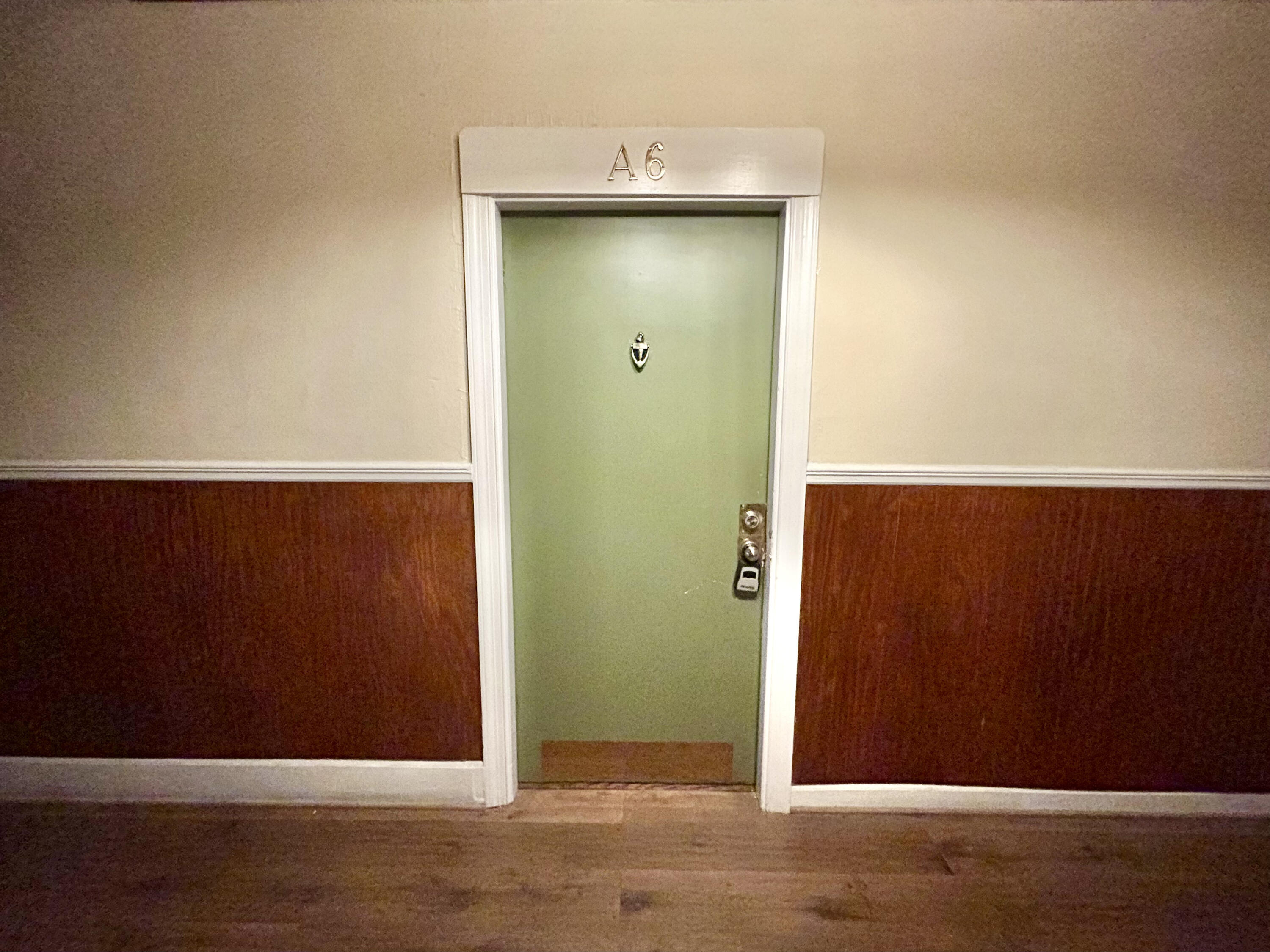 202 Elm Avenue, Unit A6 Roanoke, VA 24016 - Photo 11 of 19 an empty room with wooden floor and cabinet
