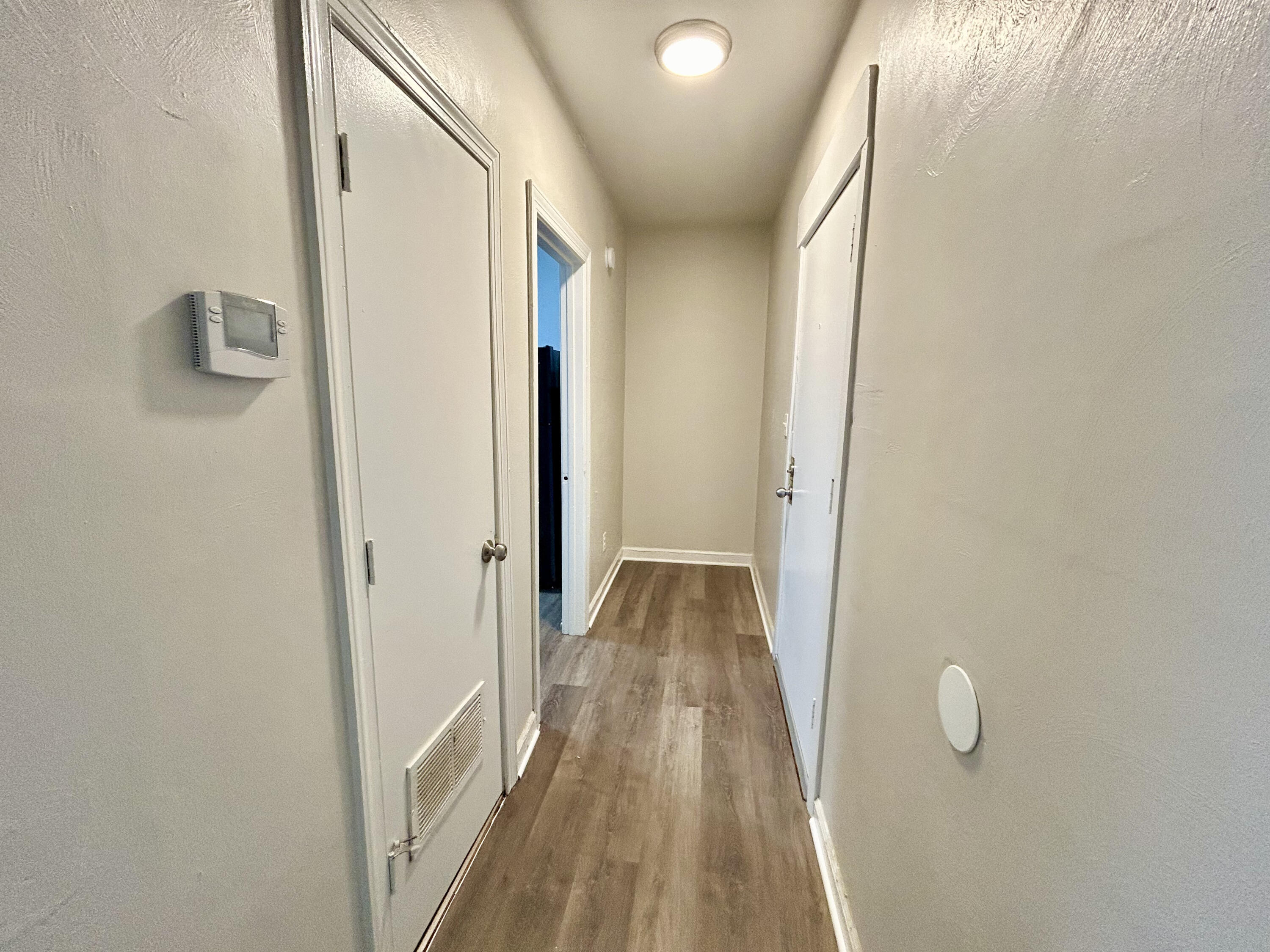 202 Elm Avenue, Unit A6 Roanoke, VA 24016 - Photo 12 of 19 a view of a hallway with wooden floor and cabinet
