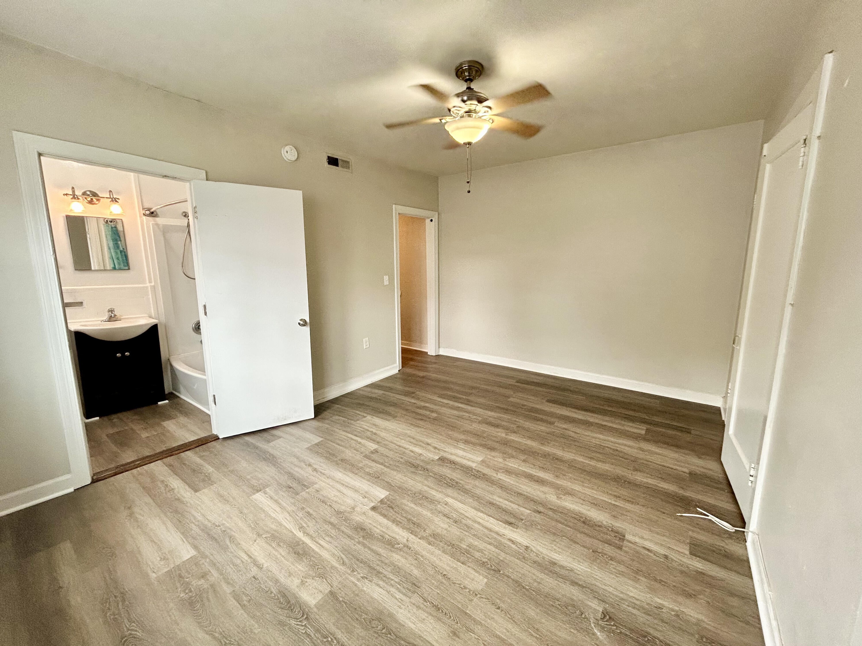 202 Elm Avenue, Unit A6 Roanoke, VA 24016 - Photo 14 of 19 wooden floor in an empty room with a window