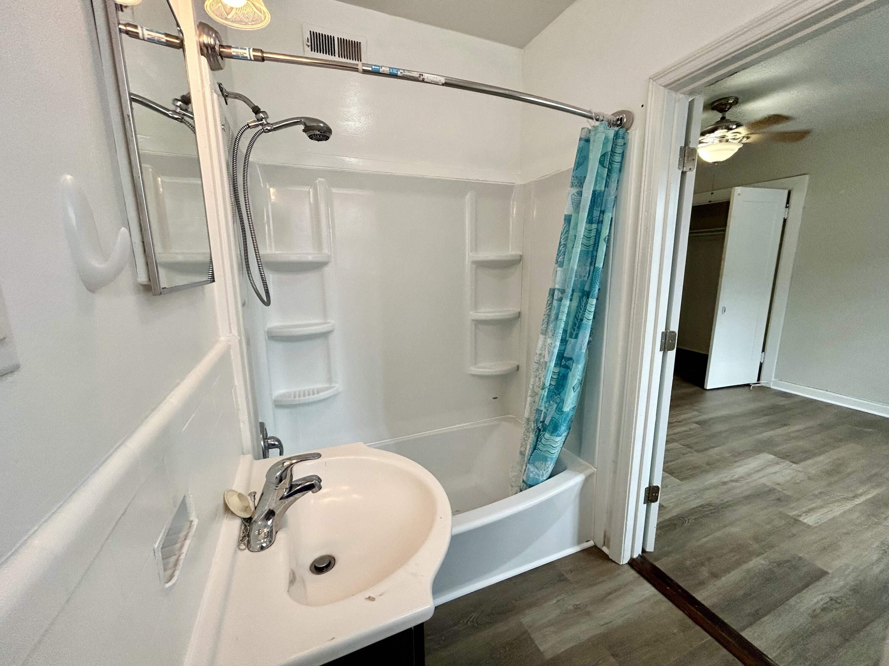 202 Elm Avenue, Unit A6 Roanoke, VA 24016 - Photo 15 of 19 a bathroom with a tub and shower