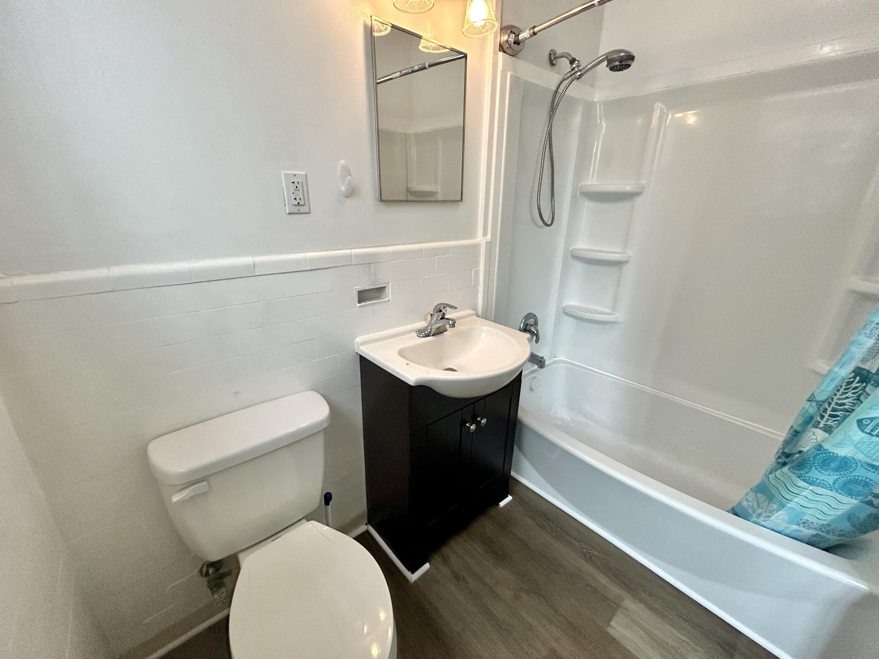 202 Elm Avenue, Unit A6 Roanoke, VA 24016 - Photo 16 of 19 a bathroom with a sink toilet and shower