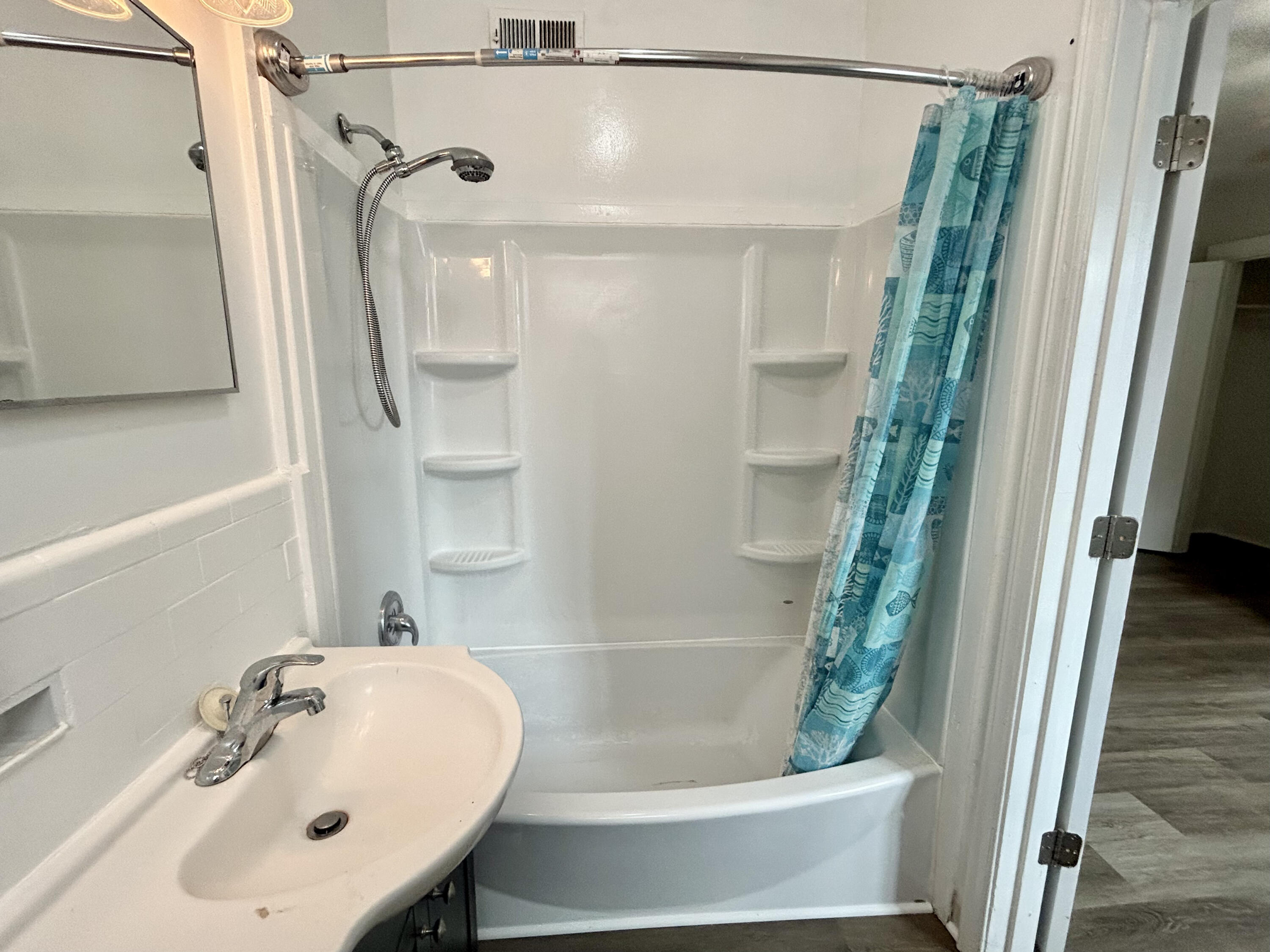 202 Elm Avenue, Unit A6 Roanoke, VA 24016 - Photo 17 of 19 a bathroom with a shower and a sink
