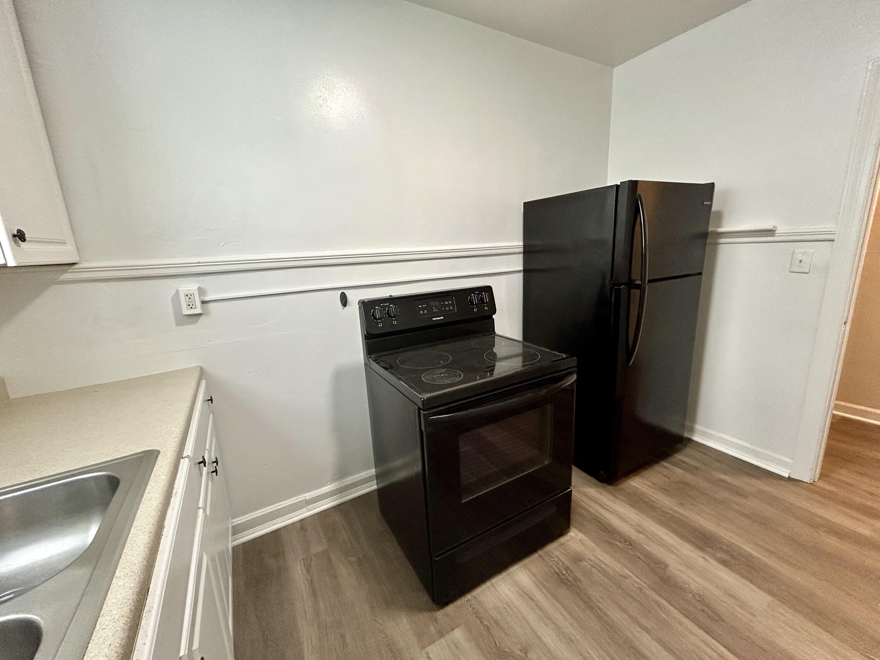 202 Elm Avenue, Unit A6 Roanoke, VA 24016 - Photo 19 of 19 a kitchen with a refrigerator stove and cabinets