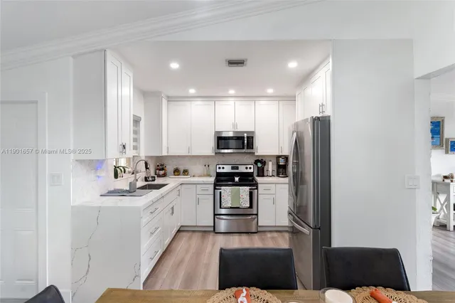 a bedroom with two beds and a window