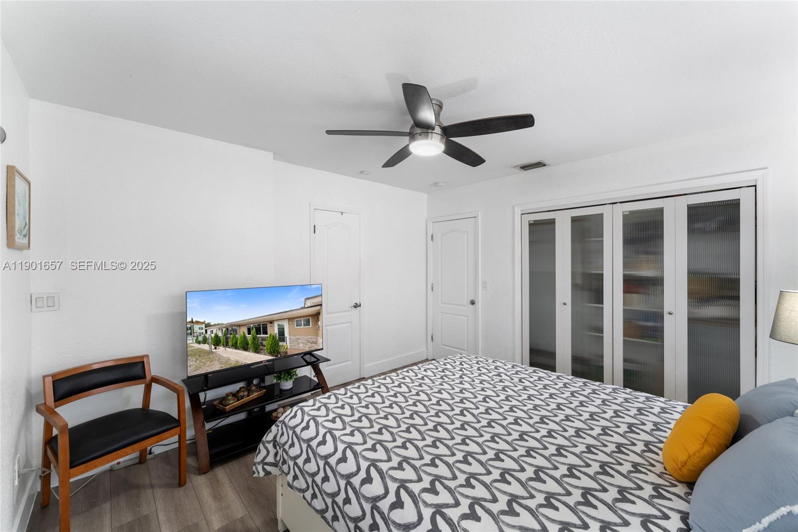 820 Southwest 17th Avenue, Unit 1 Miami, FL 33135 - Photo 16 of 19 a bedroom with a bed and a window