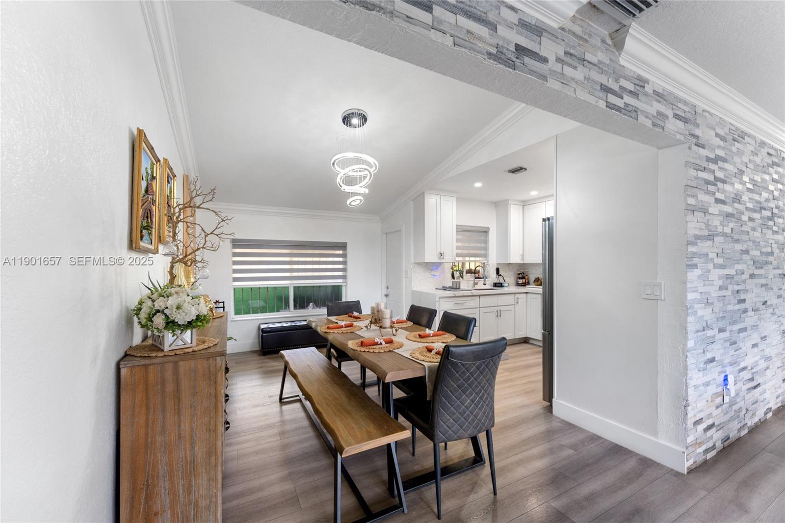 820 Southwest 17th Avenue, Unit 1 Miami, FL 33135 - Photo 8 of 19 a dining room with furniture and wooden floor