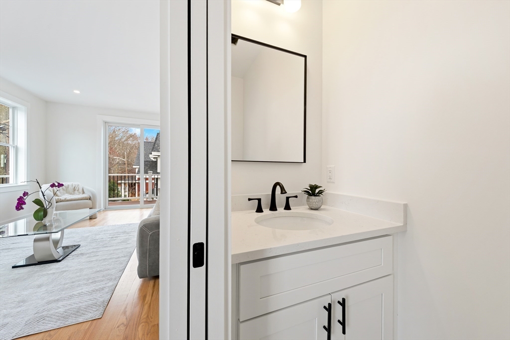 2 Old County Road, Unit 14 Salisbury, MA 01952 - Photo 10 of 33 a bathroom with a sink and a mirror