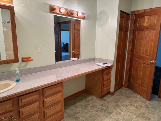 6900 North Ridge Road East Geneva, OH 44041 - Photo 22 of 37 Bathroom featuring tile patterned floors and vanity