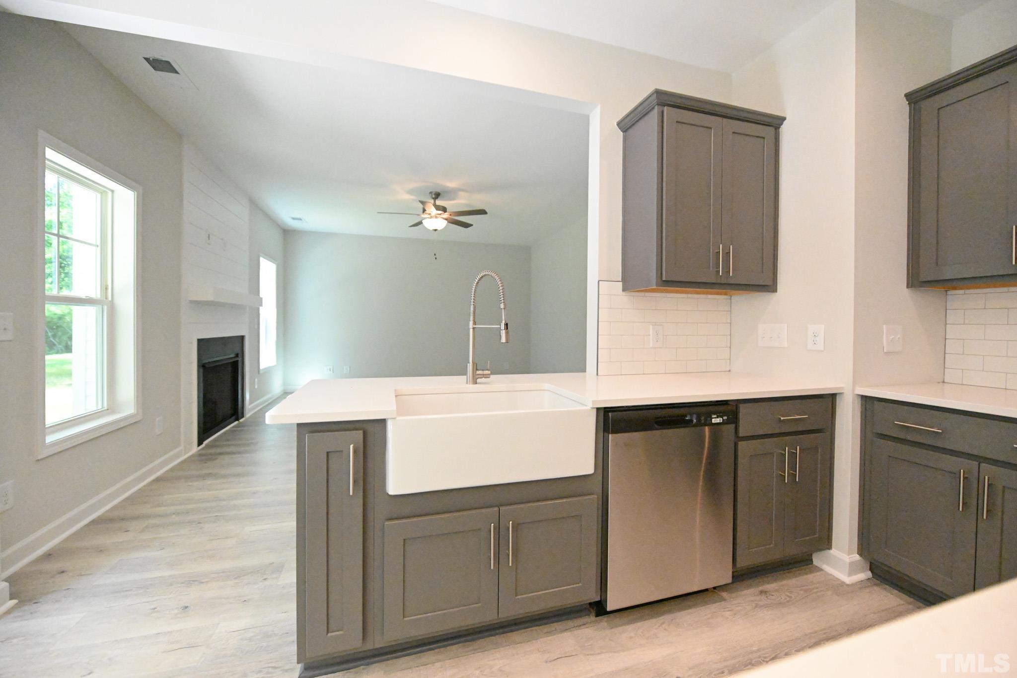 11 Kevin Troy Court Angier, NC 27501 - Photo 13 of 35 a kitchen with cabinets and flat screen tv
